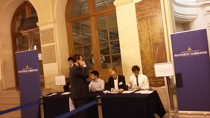 Voluntary students check attendees' registrations before letting us in